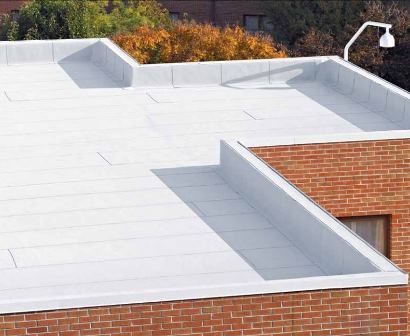Roofs coated with reflective roofing technology, such as CertainTeed’s CoolStar coating, can make a huge difference in the amount of energy a building consumes. Image ©2015 CertainTeed Corp.